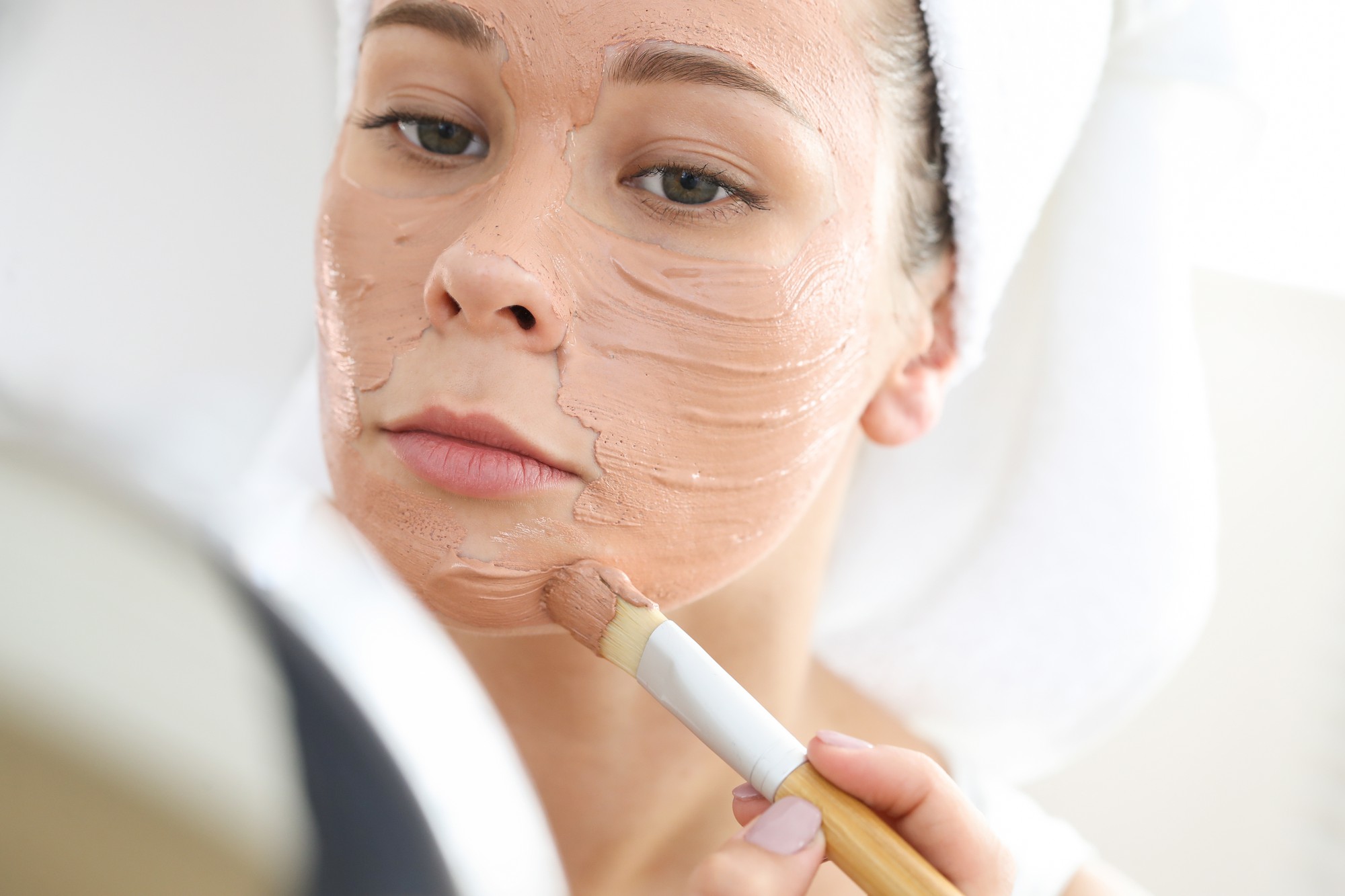 Client relaxing during a customised facial at e-skin